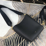 Handle and strap detail of modern structured women's handbag – women's luxury handbag