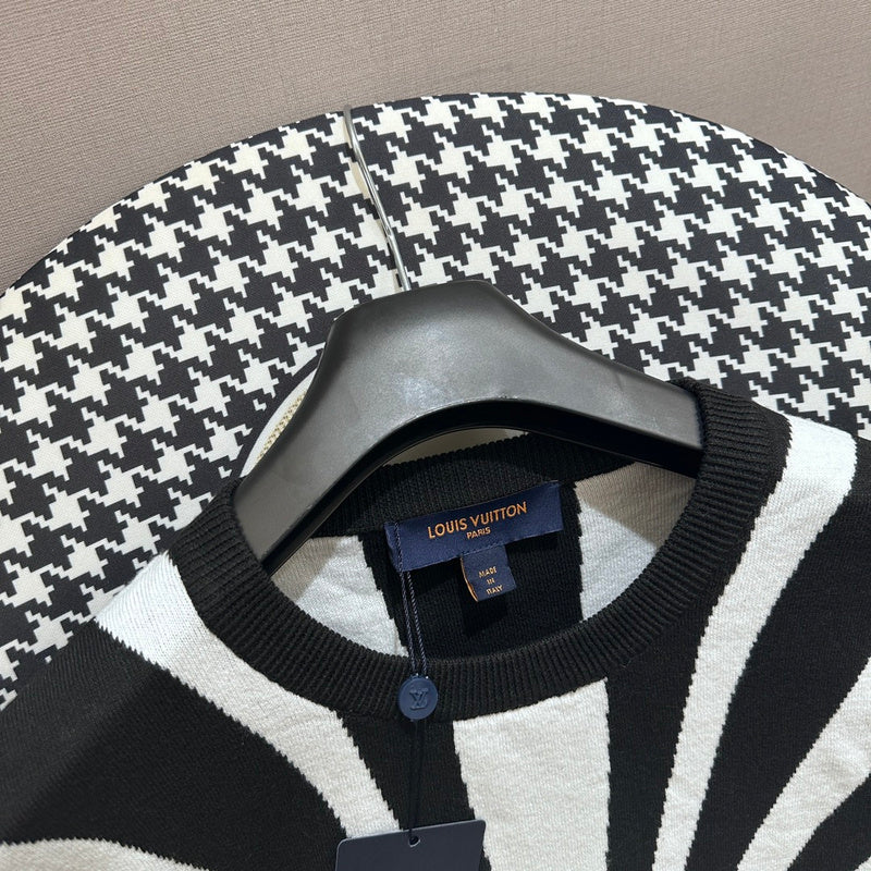 Flat lay presentation of Louis Vuitton luxury clothing with runway-inspired design