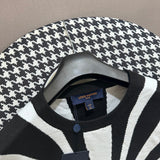 Flat lay presentation of Louis Vuitton luxury clothing with runway-inspired design