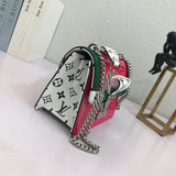 Close-up detail of structured modern women's handbag – women's statement bag