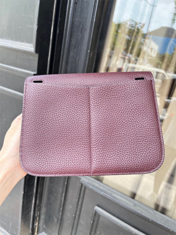  Classic top-handle bag carried on shoulder
