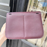  Classic top-handle bag carried on shoulder