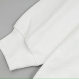 Side profile of Louis Vuitton luxury clothing with signature branding