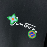 Flat lay presentation of Louis Vuitton luxury clothing with logo-detail design