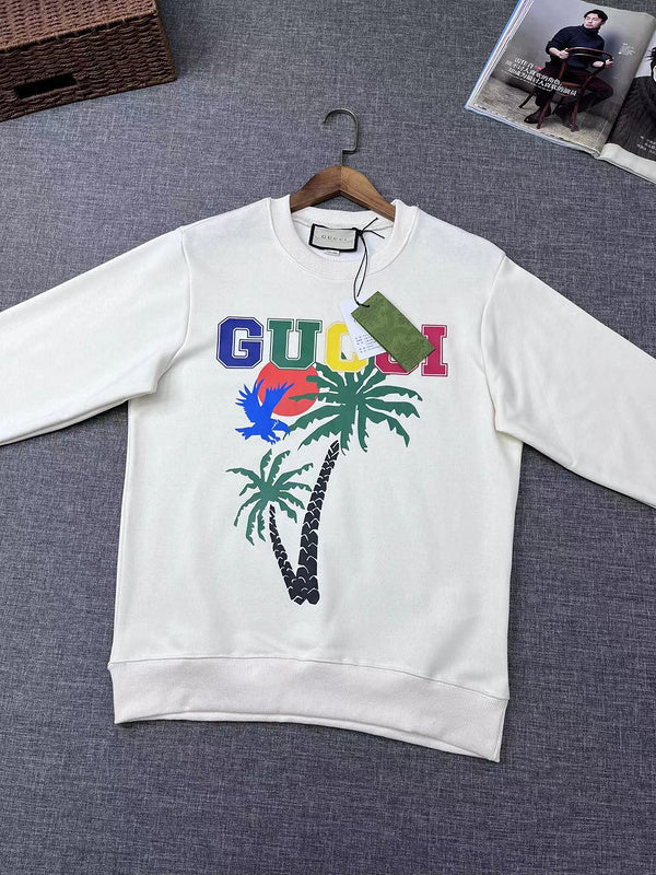 Flat lay presentation of Gucci luxury clothing with signature branding