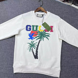 Flat lay presentation of Gucci luxury clothing with signature branding