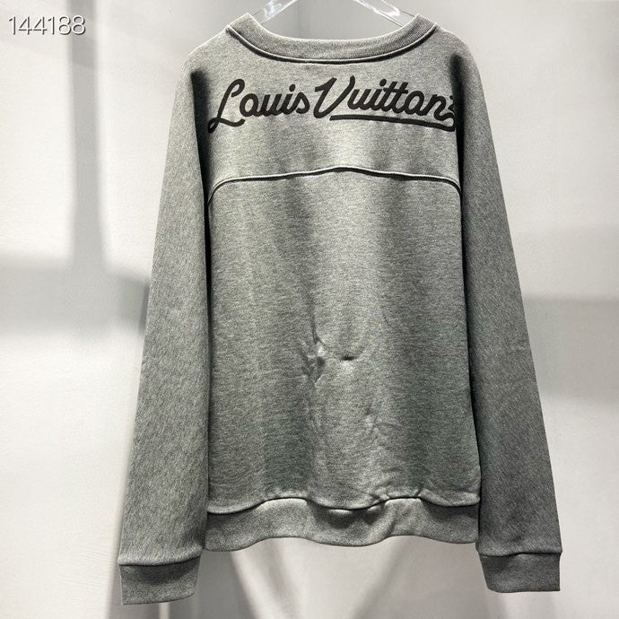 Close-up detail shot of Louis Vuitton luxury clothing with everyday silhouette