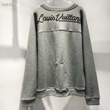 Close-up detail shot of Louis Vuitton luxury clothing with everyday silhouette