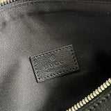 Side profile of structured classic women's handbag – women's luxury accessory