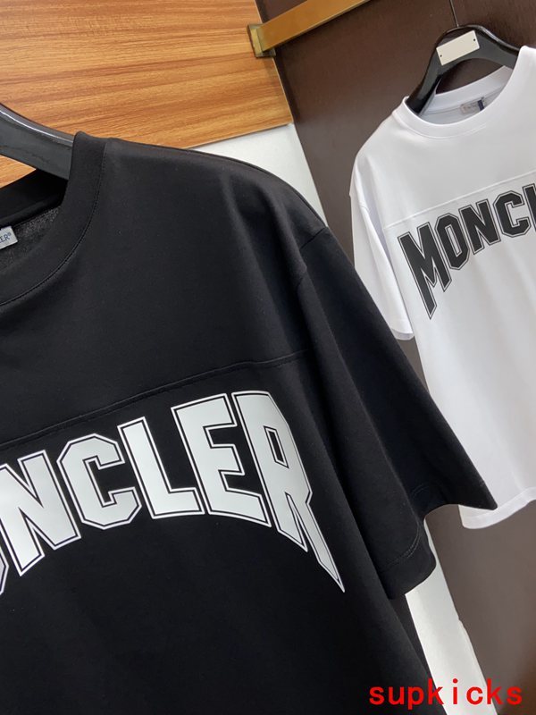 Flat lay presentation of Moncler luxury clothing with relaxed-fit cut