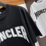 Flat lay presentation of Moncler luxury clothing with relaxed-fit cut