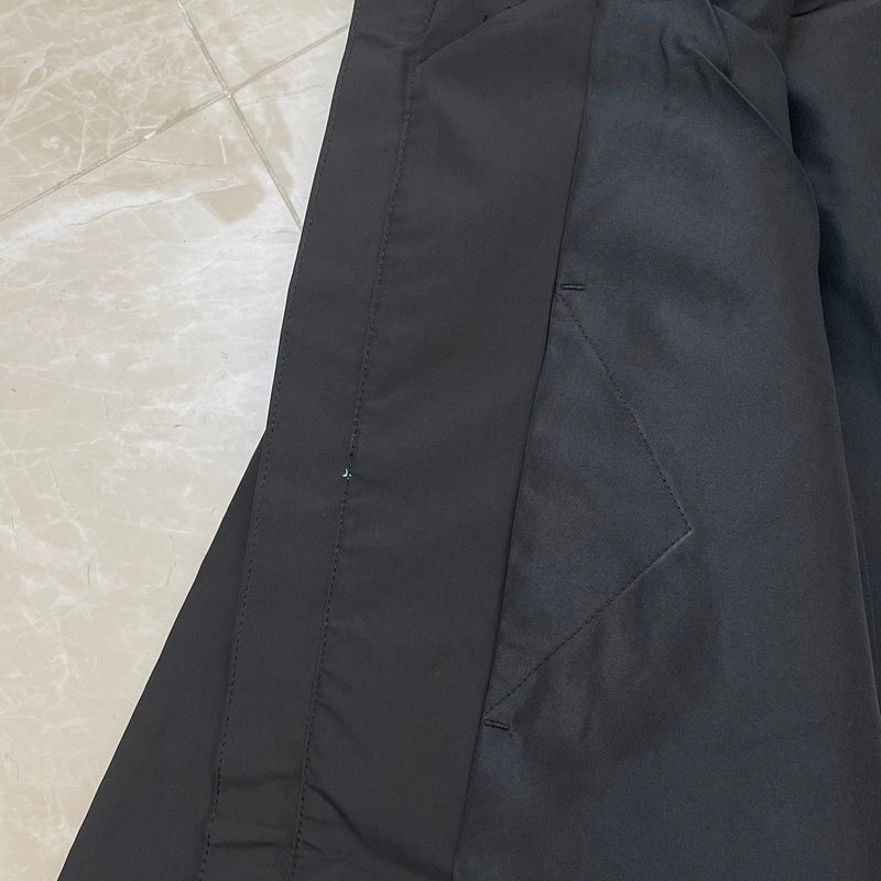 Close-up detail shot of Louis Vuitton luxury clothing with monogram-inspired silhouette