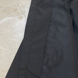Close-up detail shot of Louis Vuitton luxury clothing with monogram-inspired silhouette
