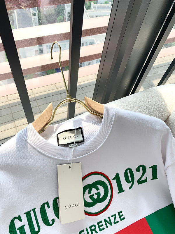 Front view of Gucci luxury clothing with monogram-inspired silhouette