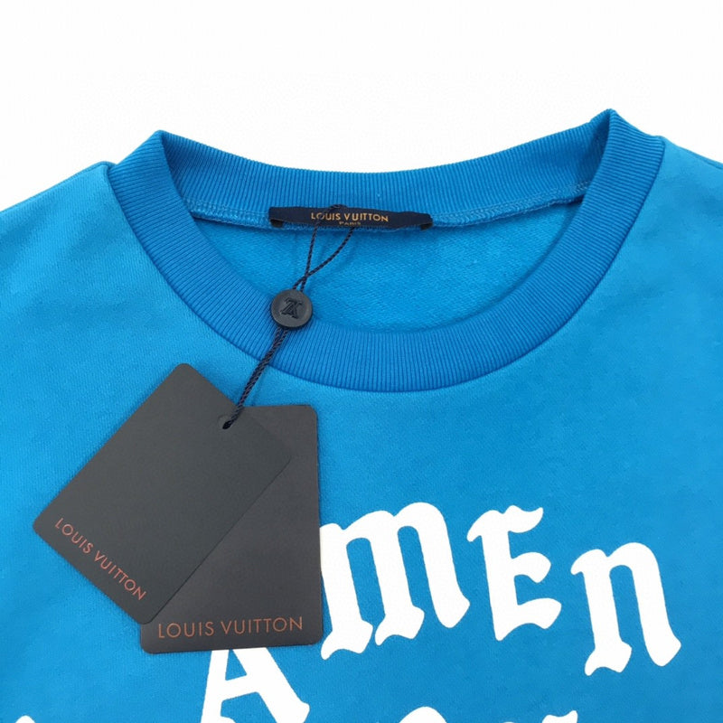 Flat lay presentation of Louis Vuitton luxury clothing with signature branding