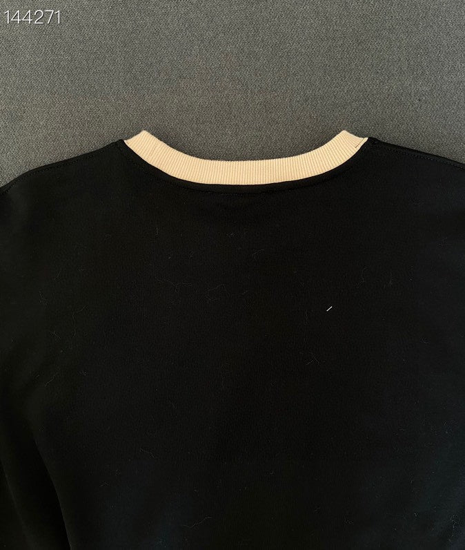Close-up detail shot of Louis Vuitton luxury clothing with everyday silhouette