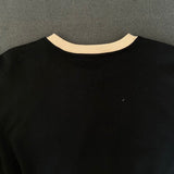 Close-up detail shot of Louis Vuitton luxury clothing with everyday silhouette