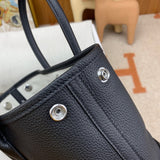Side view of fluid structured handbag