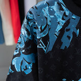 Flat lay presentation of Louis Vuitton cotton t-shirt with logo-detail design