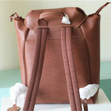  refined top-handle bag styled with outfit