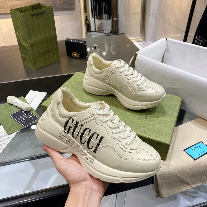 Side profile of Gucci fresh white-and-black sneakers streetwear statement look