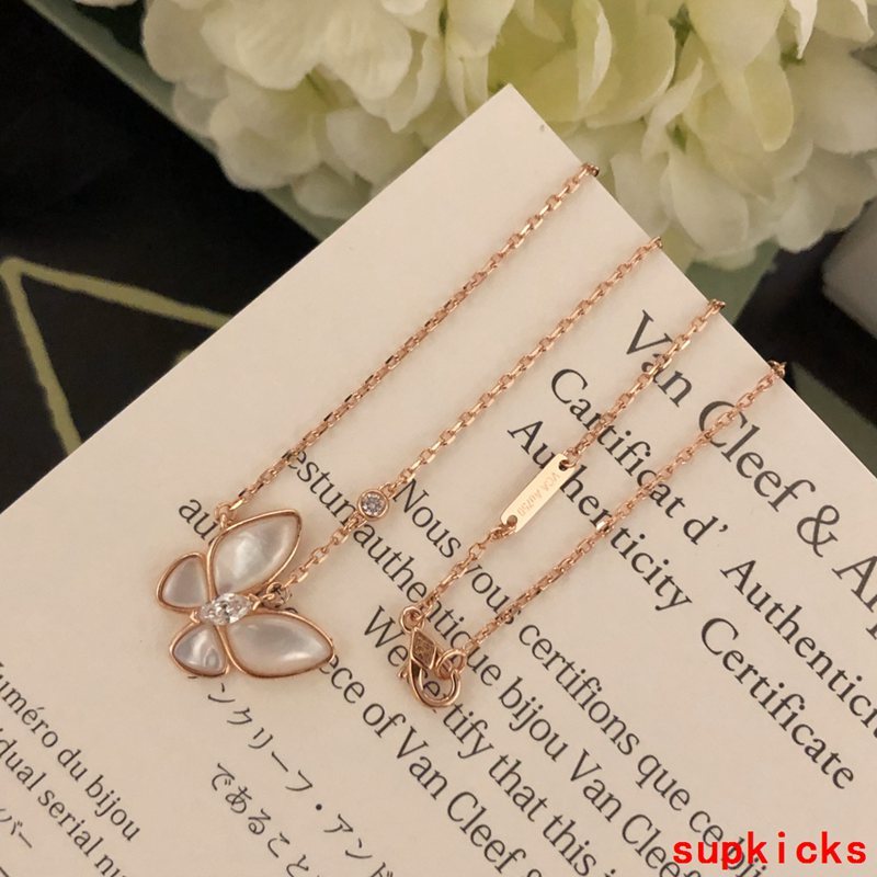 Lifestyle view of Van Cleef & Arpels unisex jewelry piece