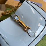 Side profile of premium signature women's handbag – women's designer-style accessory