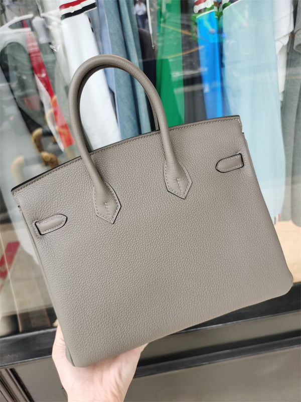  Signature shoulder bag carried on shoulder