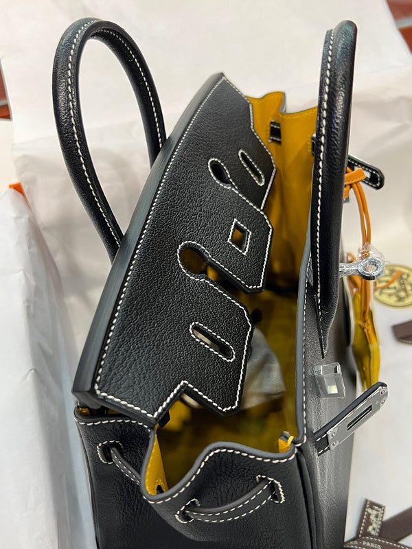 Side view of refined structured handbag