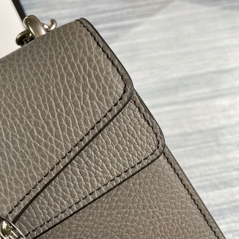 Styled lifestyle shot of classic structured women's handbag – women's designer-style accessory