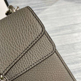 Styled lifestyle shot of classic structured women's handbag – women's designer-style accessory
