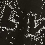 Flat lay presentation of Louis Vuitton luxury clothing with tailored silhouette