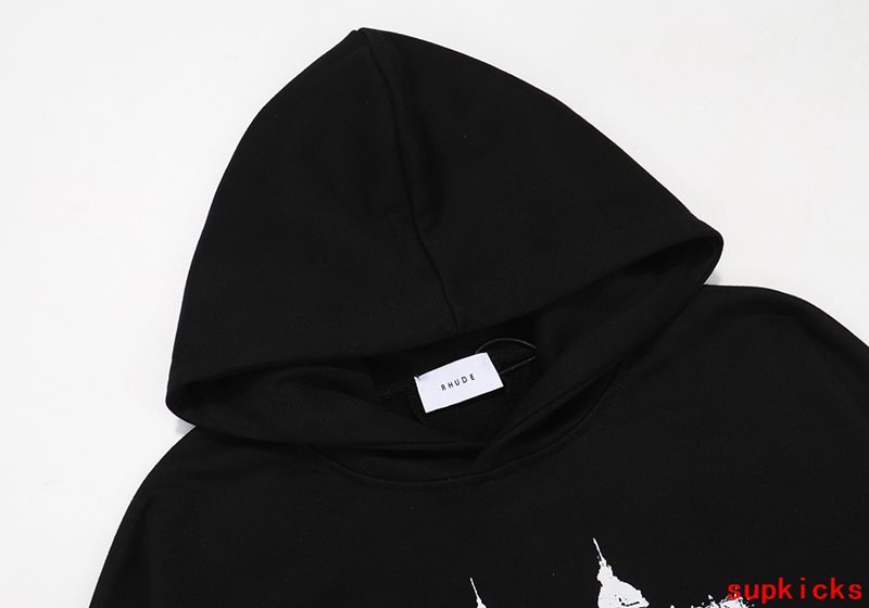 Flat lay presentation of Rhude luxury clothing with signature branding