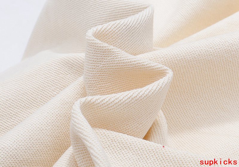 Close-up detail shot of Rhude luxury clothing with streetwear-inspired cut