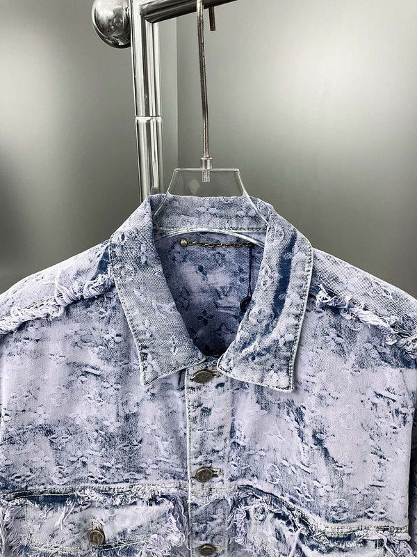 Close-up detail shot of Louis Vuitton luxury clothing with signature branding