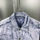 Close-up detail shot of Louis Vuitton luxury clothing with signature branding