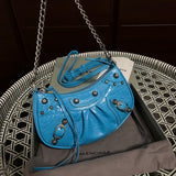 Handle and strap detail of elevated modern women's handbag – women's luxury accessory