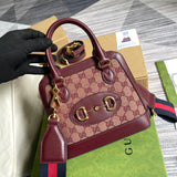 Front view of elevated sleek women's handbag – women's luxury accessory