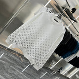 Close-up detail shot of Louis Vuitton luxury clothing with contemporary cut