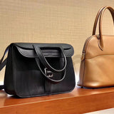 Side view of understated structured handbag