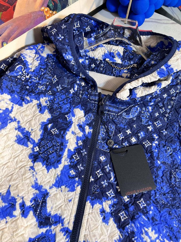 Flat lay presentation of Louis Vuitton luxury clothing with everyday silhouette