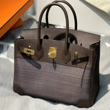 Side view of refined structured handbag