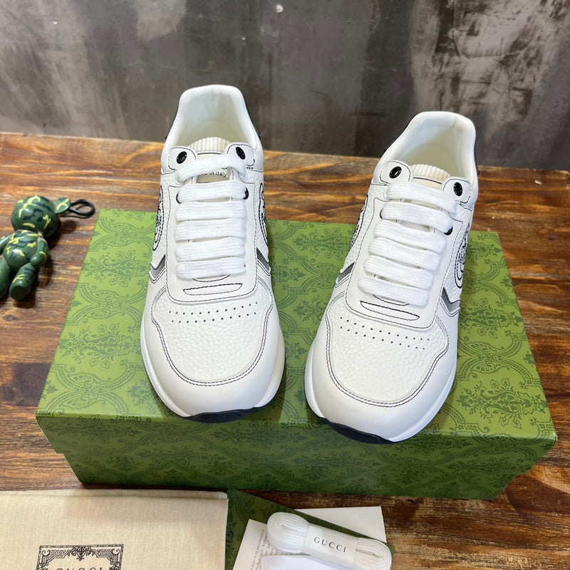 Side profile of Gucci tonal black sneakers classic court silhouette