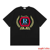 Side profile of Rhude luxury clothing with signature branding