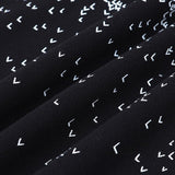 Flat lay presentation of Louis Vuitton luxury clothing with runway-inspired design