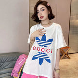 Side profile of Gucci luxury clothing with signature branding