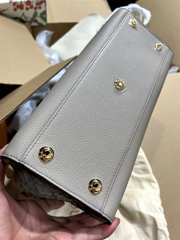  statement top-handle bag detail view showing craftsmanship