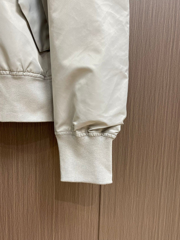 Back view of Louis Vuitton luxury clothing with label-forward styling