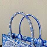Styled lifestyle shot of structured signature women's handbag – women's designer-style accessory