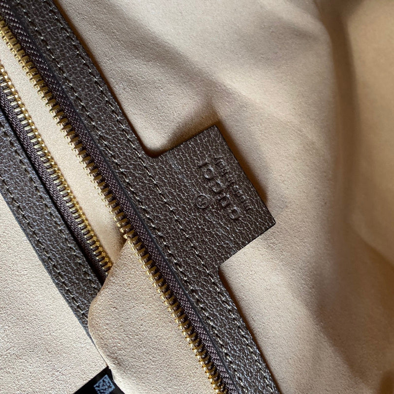 Side profile of statement premium women's handbag – women's designer-style accessory